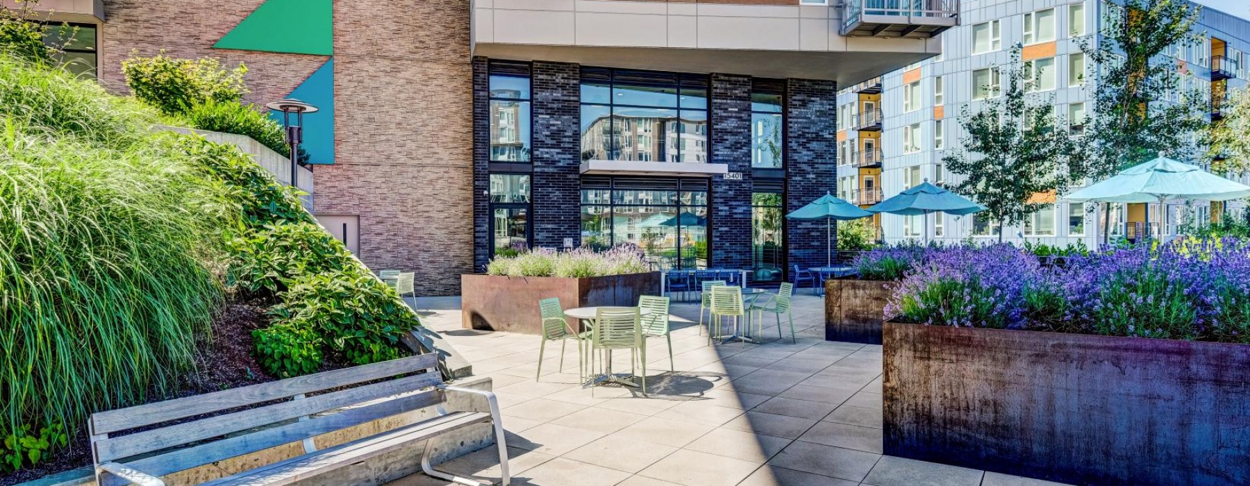 a building with a patio and chairs