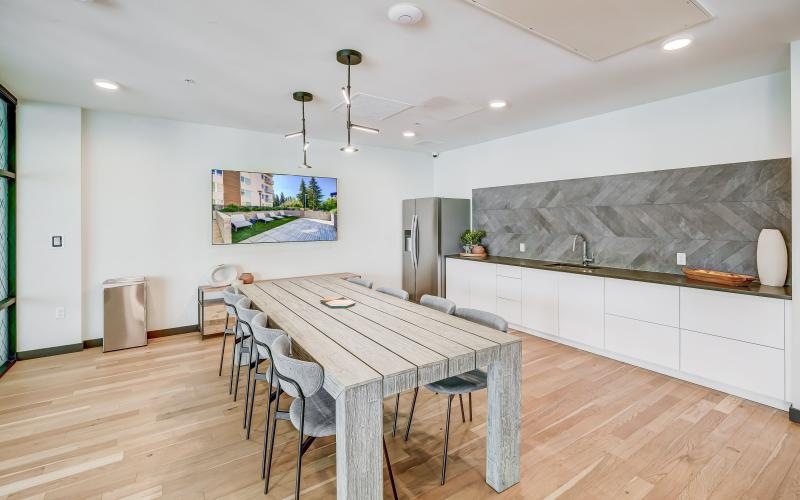 a dining room with a table and chairs