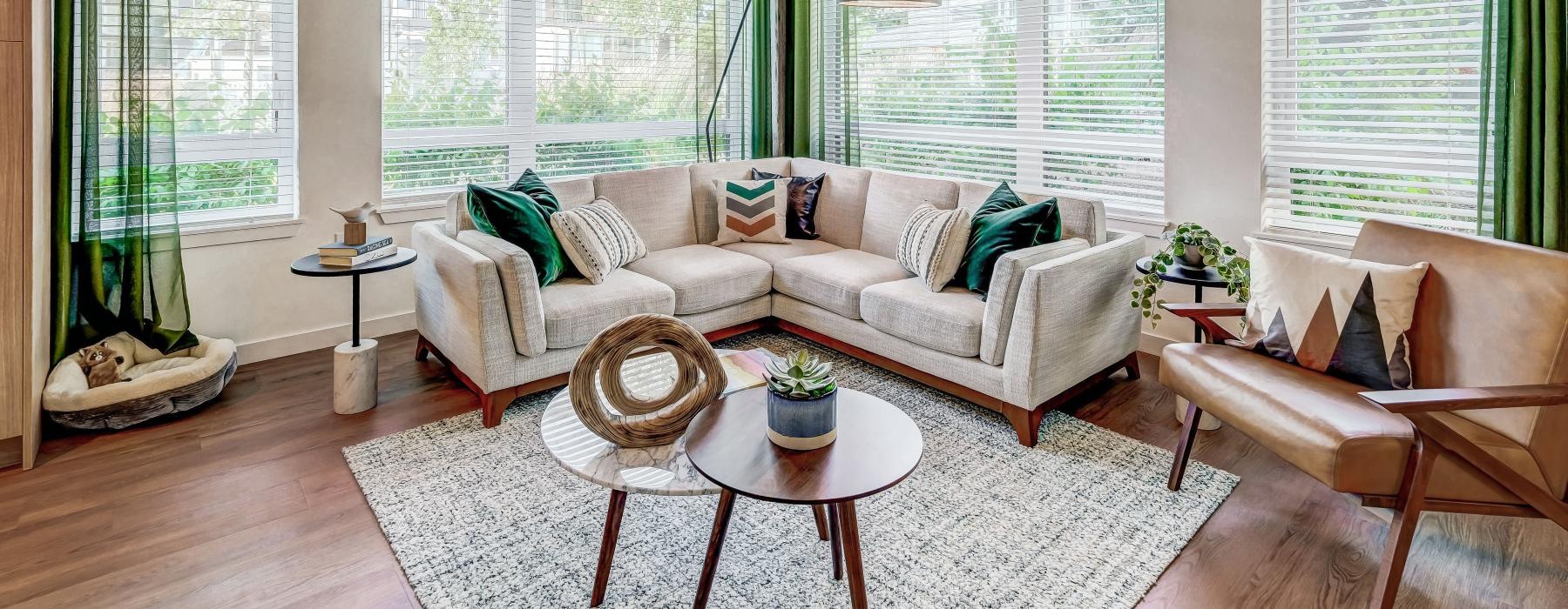 a living room with a couch and chairs